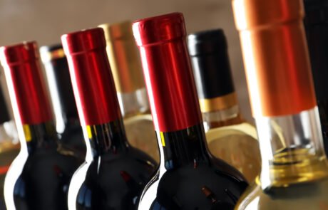 Bottles with delicious wine, closeup. Professional sommelier